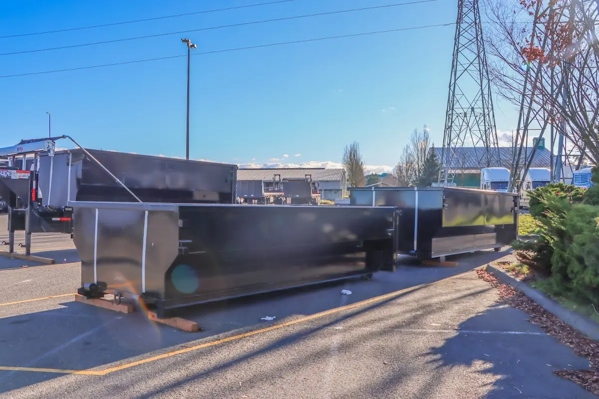 Roll-off dumpster ready for waste disposal at job site for 2 Yard Dumpster Rental in Kerrville
